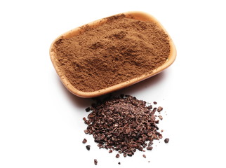 Chopped and powder cocoa pile with clay pot, bowl isolated on white background