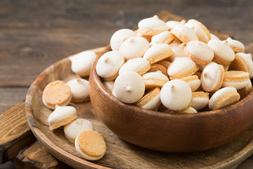 Butter cookies in a white vase on a light gray background