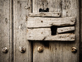 Old wooden door on a cottage in Spain