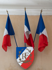 French flags and badge RF means French Republic in exterior of the city hall
