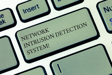 Writing note showing Network Intrusion Detection System. Business photo showcasing Safety security multimedia systems Keyboard key Intention to create computer message pressing keypad idea