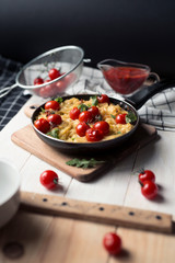 spaghetti with cherry tomatoes in a pan