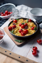 spaghetti with cherry tomatoes in a pan