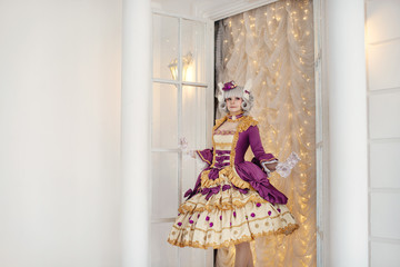 Girl in barocco baroque rococo old vintage dress and wig, cosplay costume of 15 16 17 18 19 century