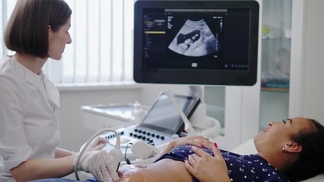 Pregnant woman on utltrasonographic examination at hospital