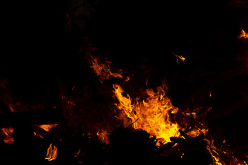 Fototapeta na wymiar The movement of the flames in the dark