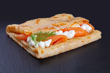 Pancake with salmon and cheese