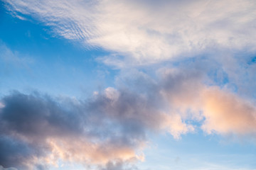 Fototapeta na wymiar Clouds near sunset before rain blue sky