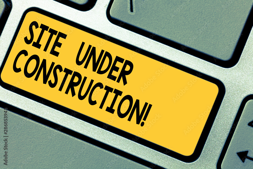 Fototapete Handwriting text Site Under Construction. Concept meaning Implies something is being built for the first time Keyboard key Intention to create computer message pressing keypad idea