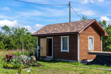 Small summer hut on plot of land in the country