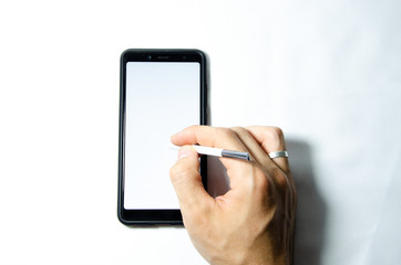 Electronic signature by a male hand on a smartphone with a black frame on a white background close, top, side