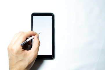 Electronic signature by a male hand on a smartphone with a black frame on a white background close, top, side