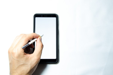 Electronic signature by a male hand on a smartphone with a black frame on a white background close,...