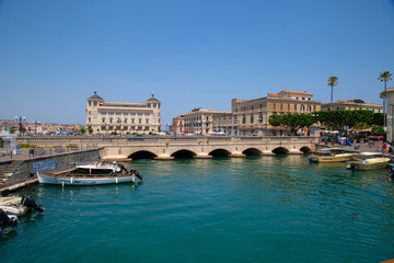 Amazing view of the harbor and bridge of Ortigia Island.