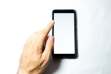 Smartphone in male hands on a white background