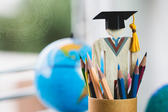 Graduate or Education knowledge learning study abroad concept : Graduation cap with blur america earth globe, radar background, alternative studying distant for learn. Back to School and successful