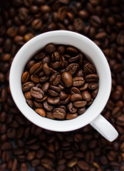 Coffee beans in a white mug