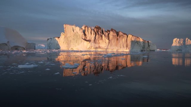 Pan: Majestic iceberg and its reflection in bay of Greenland - Disko Bay, Greenland