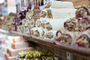 Oriental pastry on the counter. Turkish sweets Turkish delight and others in shop window.