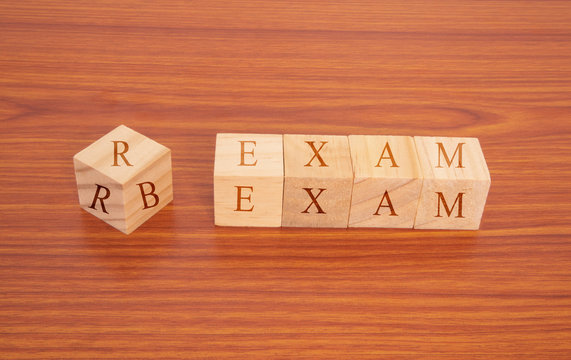 Concpet of RRB exam conducted in India for recruitment, RRB Exam on Wooden block letters.
