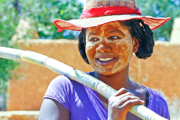 Portrait of malagasy woman with traditional mask on the face, Madagascar