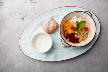 Healthy breakfast bowl served with croissant