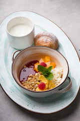 Healthy breakfast bowl served with croissant