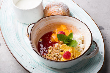 Healthy breakfast bowl served with croissant