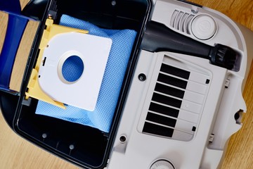 Fototapeta premium Close-up open canister vacuum cleaner with empty clean dust bag