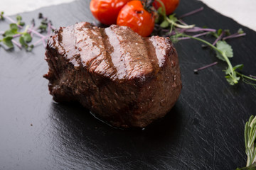 Prepared beef steak served with herbs