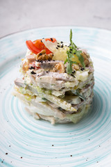 Traditional russian salad served on plate for dinner