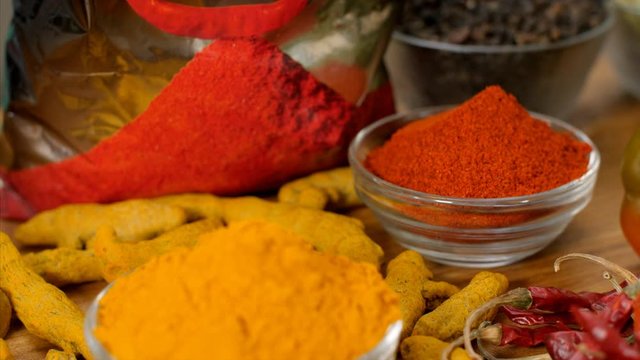 Pan shot of Indian dried spices lying on the table. 