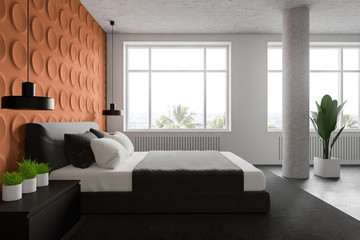 Side view of orange and white bedroom