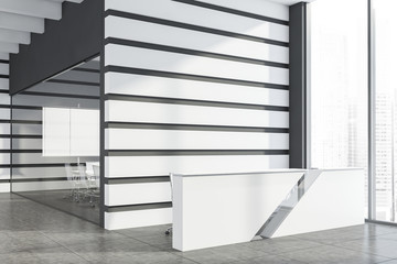 White reception desk and meeting room