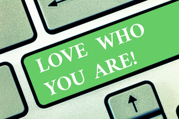 Writing note showing Love Who You Are. Business photo showcasing Expressing roanalysistic feelings and positive emotions Keyboard key Intention to create computer message pressing keypad idea