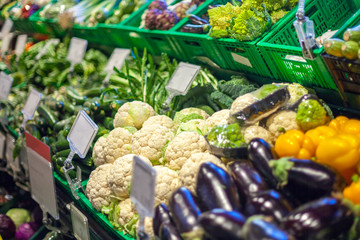 big choice of fresh fruits and vegetables on market counter