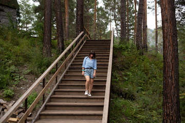Fototapeta na wymiar unhappy woman walking in the forest park