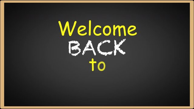 Welcome back to school writing on black chalkboard. Educational concept