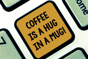 Text sign showing Coffee Is A Hug In A Mug. Conceptual photo Expressing love feelings by giving hot beverages Keyboard key Intention to create computer message pressing keypad idea