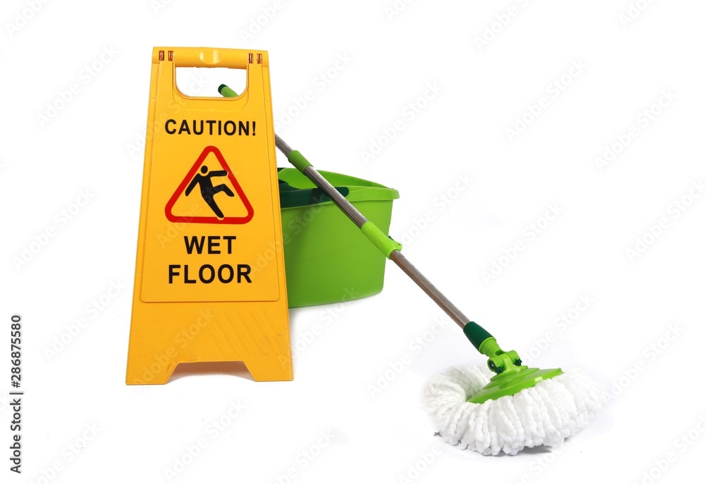 Wall mural Yellow Caution slippery wet floor sign with mop and bucket in the background - Safety sign cleaning service - isolated on white background