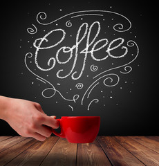 Steaming cup of coffee with white doodle line art and coffee inscription
