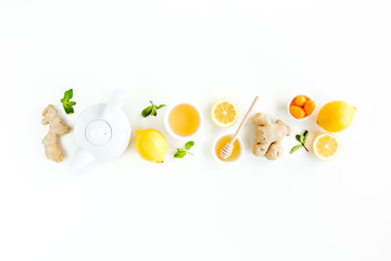 Herbal tea with mint, ginger, lemon, honey and other herbs on white background. Flat lay, top view.
