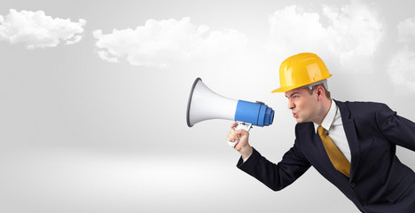 Fototapeta premium Young supervisor architect yelling to far big city panorama