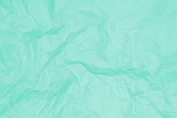 Green crumpled sheet of paper, background, texture