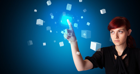 Woman touching hologram screen displaying cube symbols