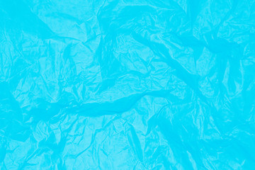 Blue crumpled sheet of paper.