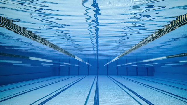 Olympic Swimming pool under water background.