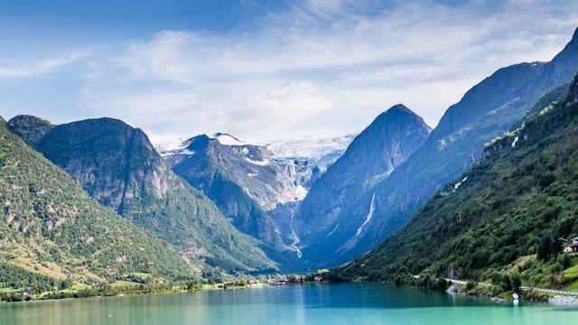 Oldedalen valley with majestic mountains, rivers, waterfalls and impressive Jostedalsbreen glacier in the background in Norway, Scandinavia