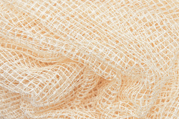 Light fabric, mesh, lace fabric texture, beautifully draped background closeup.