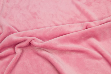 The blanket of furry fleece fabric. A background soft plush fleece material with a lot of relief folds